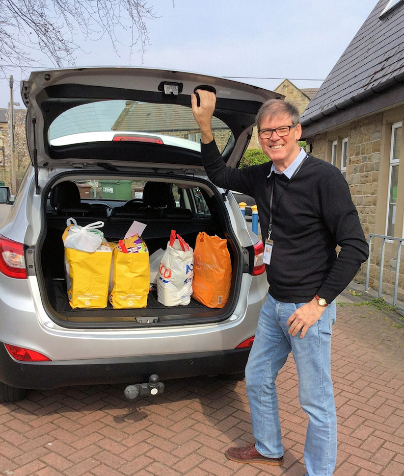 Rtn Nick Hunter with food parcels